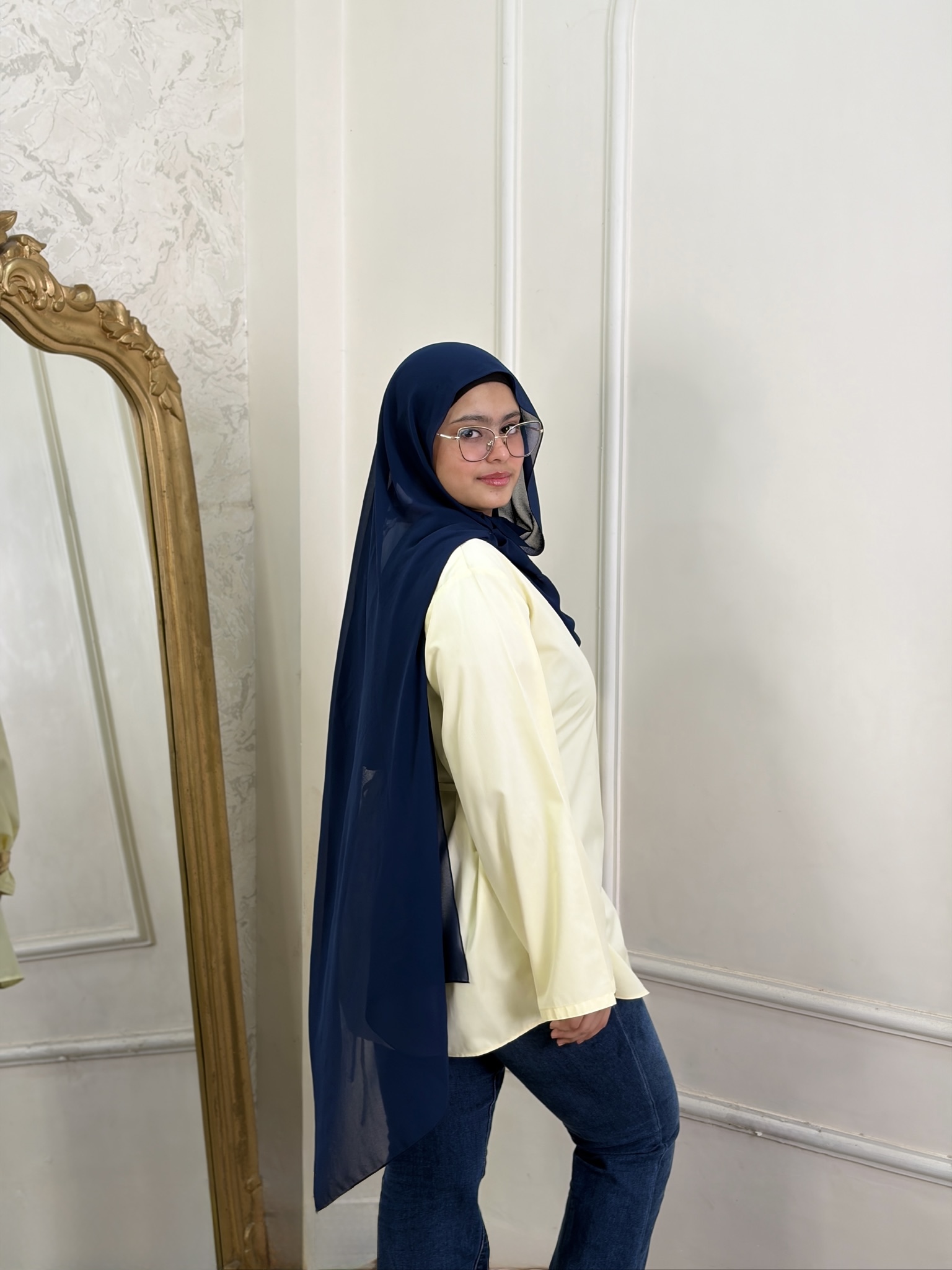 Woman wearing Tinker Asymmetric Top in butter yellow
